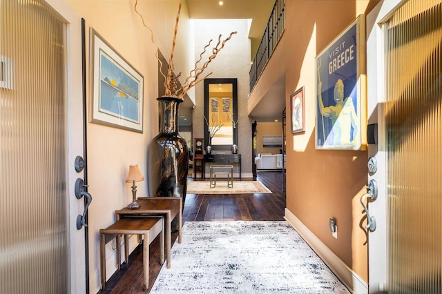 hall with dark wood-type flooring