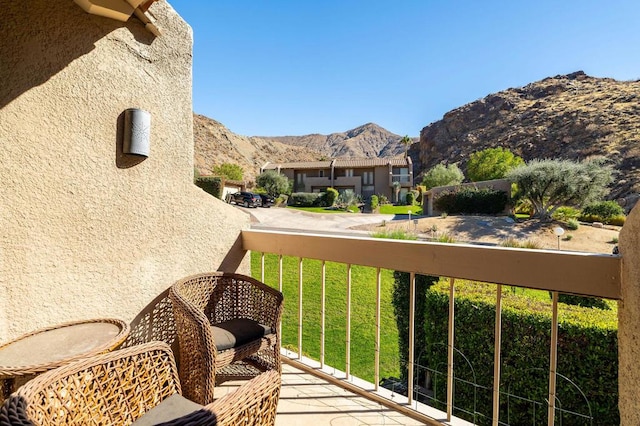 balcony featuring a mountain view