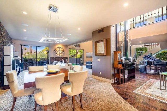 dining space with dark hardwood / wood-style floors