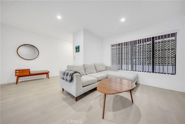 living room with light hardwood / wood-style flooring