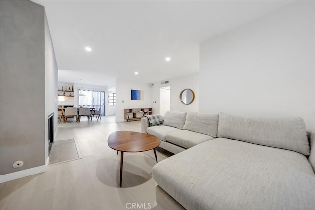 living room with light hardwood / wood-style floors