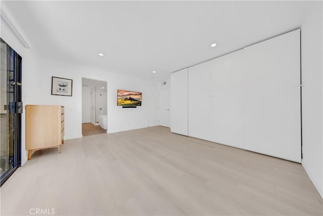 unfurnished living room with light wood-type flooring