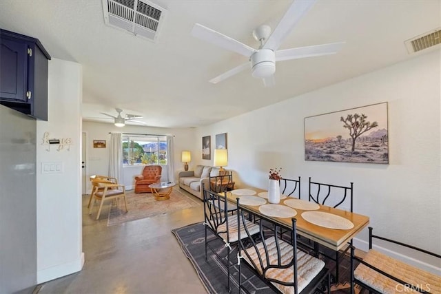 dining room featuring concrete floors and ceiling fan