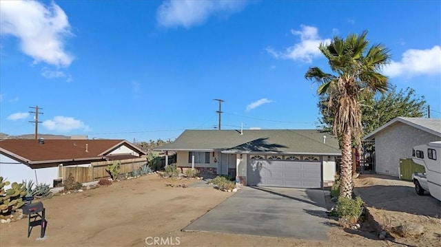 ranch-style house featuring a garage