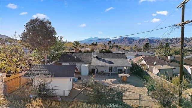 birds eye view of property featuring a mountain view