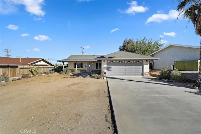 single story home featuring a garage