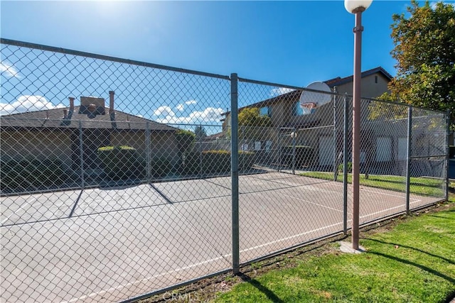 view of sport court featuring basketball hoop