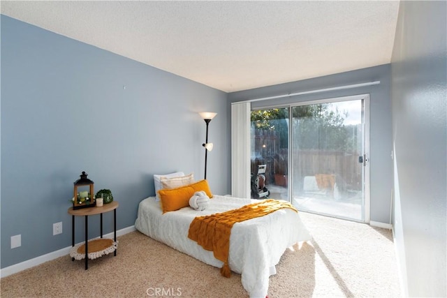 bedroom featuring light colored carpet and access to outside