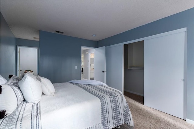 carpeted bedroom with a closet