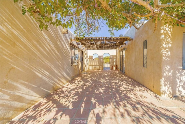 view of side of home featuring a pergola