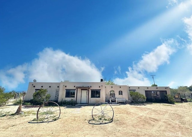 view of adobe home