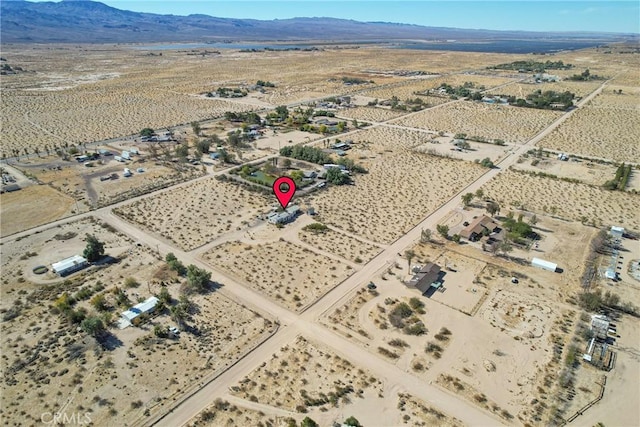 drone / aerial view featuring a mountain view