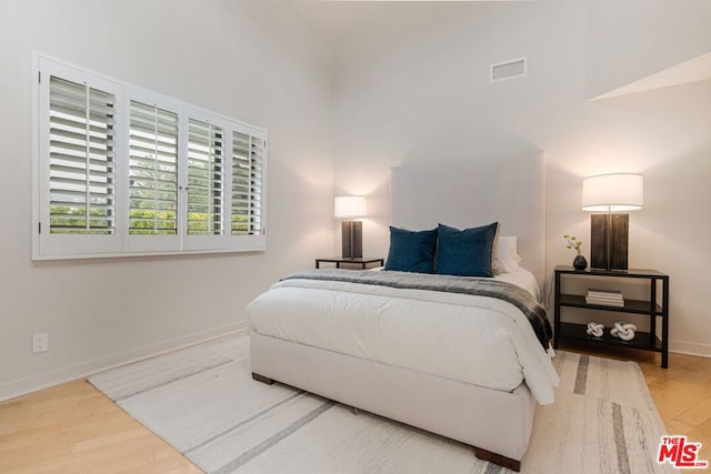 bedroom featuring hardwood / wood-style flooring