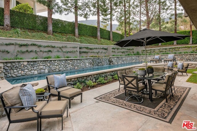 view of patio / terrace with a mountain view