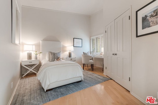 bedroom with a closet and light wood-type flooring