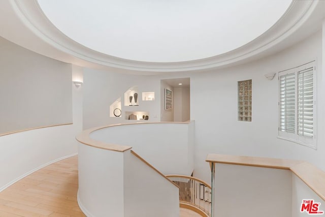 corridor featuring light hardwood / wood-style floors