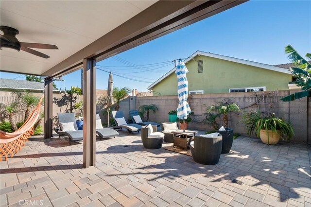 view of patio with an outdoor hangout area and ceiling fan