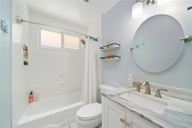 full bathroom featuring shower / tub combo with curtain, vanity, and toilet