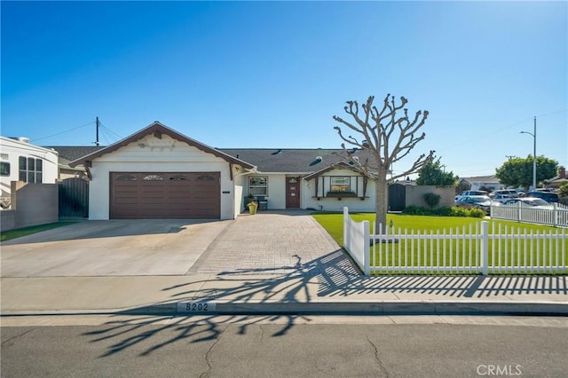 view of front of property with a garage and a front yard