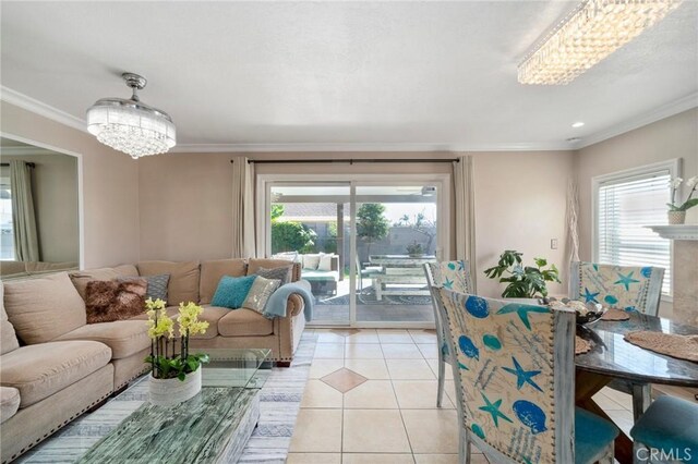 living room featuring a notable chandelier, crown molding, and light tile patterned flooring