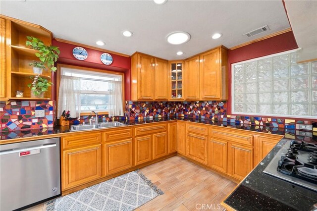 kitchen with backsplash, sink, stainless steel dishwasher, light hardwood / wood-style floors, and gas cooktop