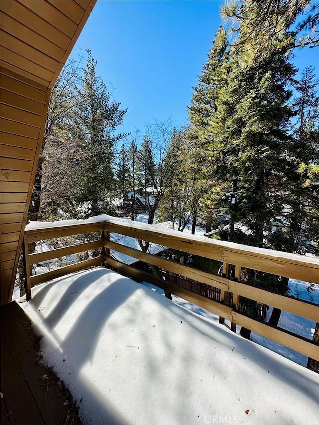 view of snow covered deck