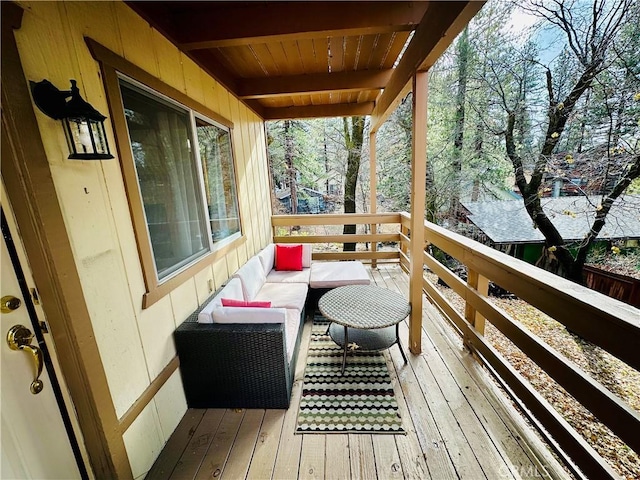 wooden terrace featuring outdoor lounge area