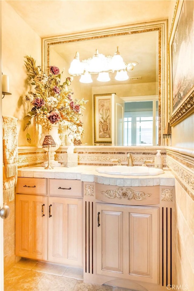 bathroom featuring tile patterned floors, vanity, and tile walls