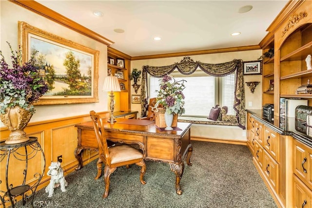 home office featuring built in shelves, dark carpet, and crown molding