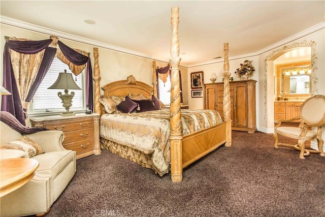 bedroom with dark colored carpet, connected bathroom, and ornamental molding