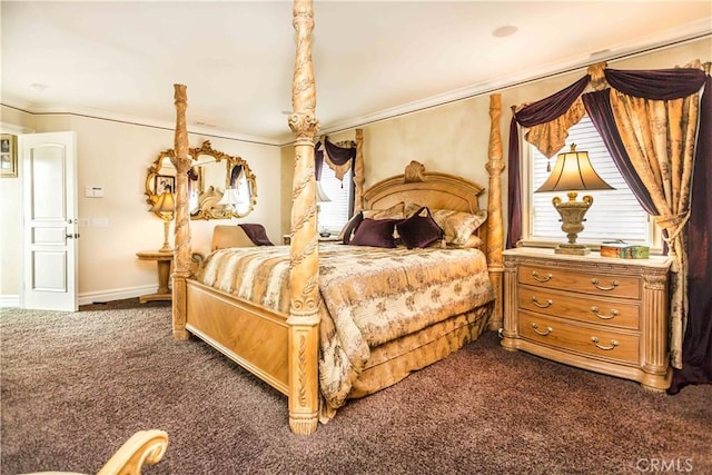 bedroom with multiple windows, crown molding, and dark colored carpet