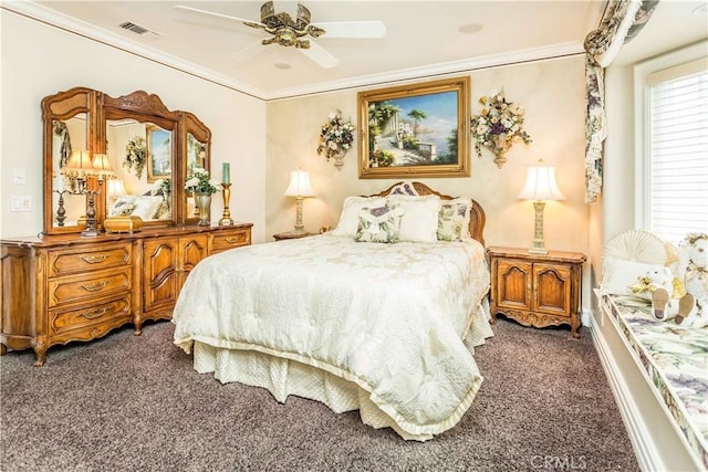 bedroom with dark colored carpet, ceiling fan, and crown molding