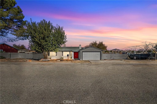 view of front of property with a garage