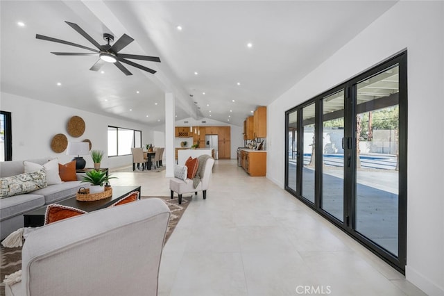 living room with ceiling fan, french doors, and vaulted ceiling with beams