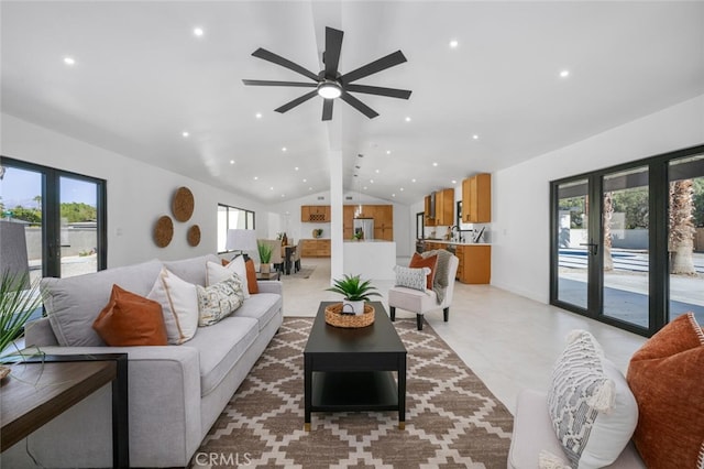 living room with lofted ceiling, a ceiling fan, and recessed lighting