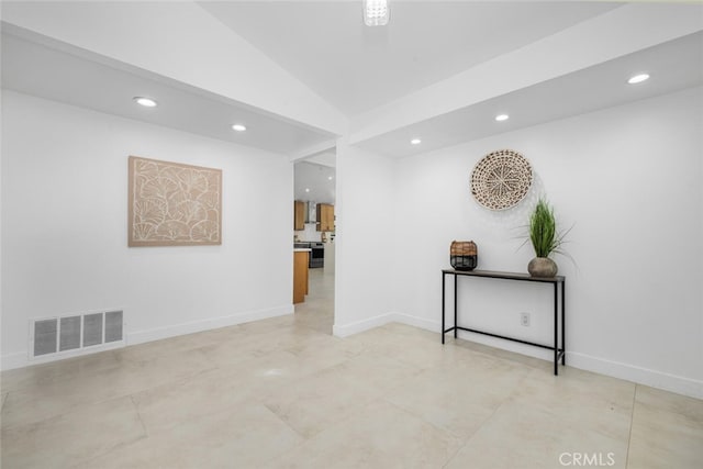 interior space featuring baseboards, lofted ceiling, visible vents, and recessed lighting