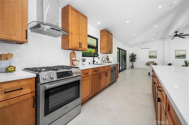 kitchen featuring extractor fan, ceiling fan, appliances with stainless steel finishes, vaulted ceiling, and sink