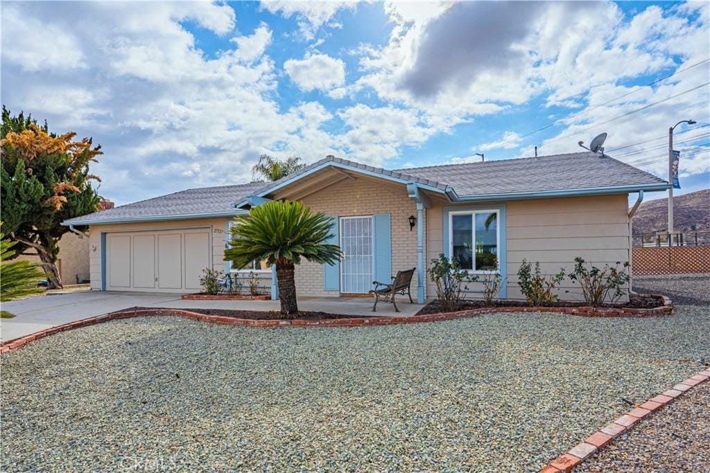 single story home with a garage