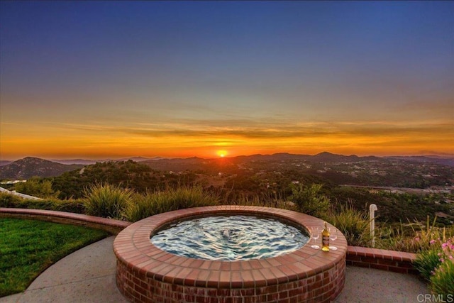 patio terrace at dusk with a mountain view