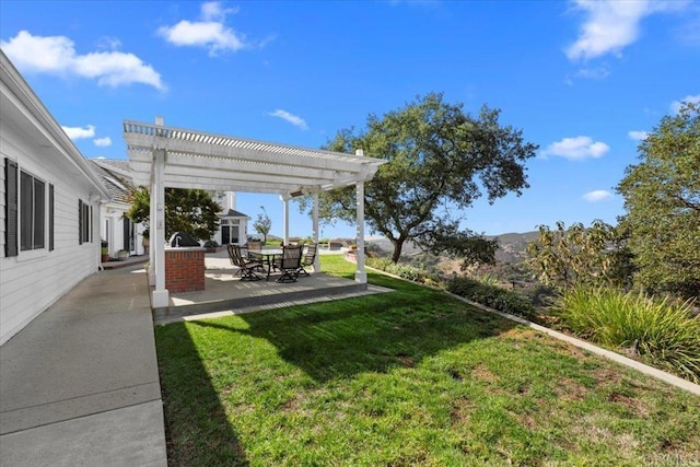 view of yard with a pergola, area for grilling, and a patio area