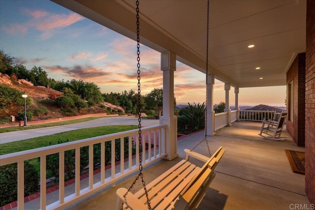 patio terrace at dusk with a porch