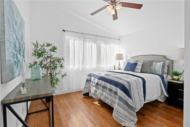 bedroom featuring vaulted ceiling, ceiling fan, and wood finished floors