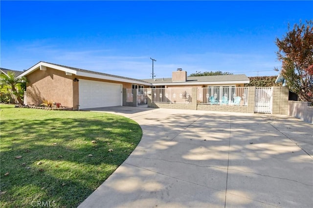 ranch-style home with a garage and a front yard