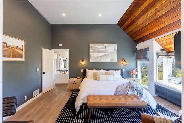 bedroom with light hardwood / wood-style flooring, wood ceiling, and lofted ceiling