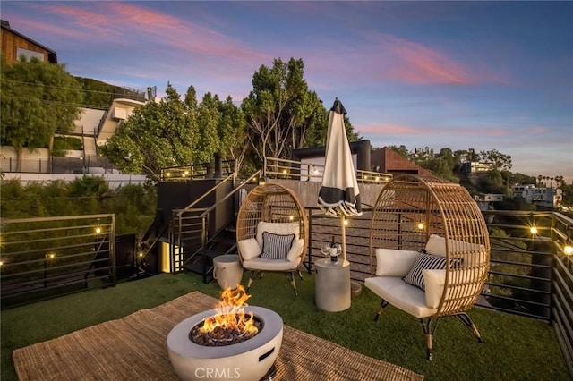 patio terrace at dusk with a fire pit