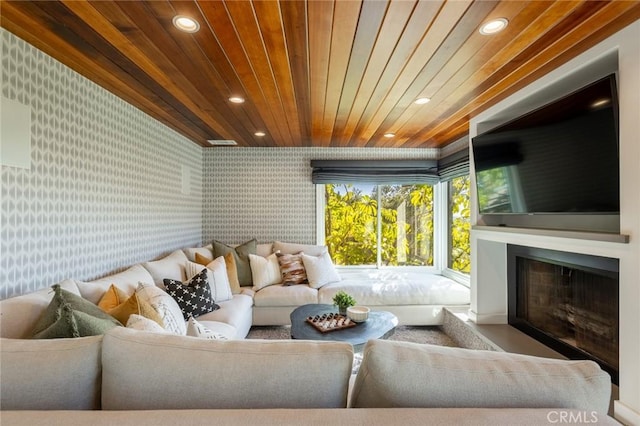 home theater room with wood ceiling