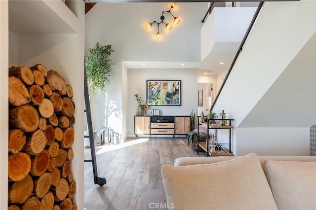 entrance foyer featuring hardwood / wood-style floors and a high ceiling