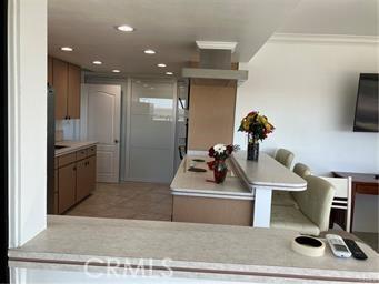 10 Hilltop, Barstow, CA 92311 - kitchen featuring light countertops, light tile patterned flooring, recessed lighting, and a center island