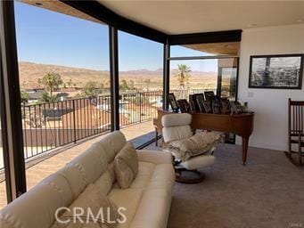10 Hilltop, Barstow, CA 92311 - carpeted living room with a mountain view and expansive windows