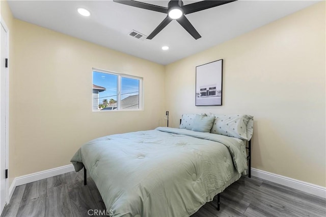 bedroom featuring hardwood / wood-style floors and ceiling fan